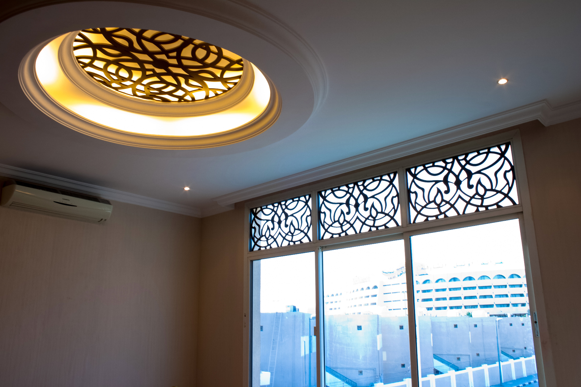 Illuminated CNC cut ceiling skylight with arabesque pattern and matching window screens